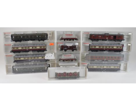 Thirteen boxed Fleischmann coaches & wagons