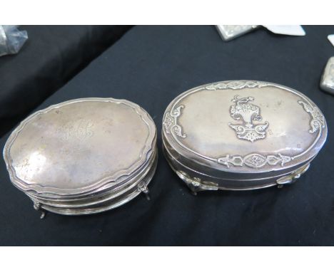 Two silver dressing table trinket boxes both on four feet. The one dated for 1914 gapes a bit and has a repaired leg. They be