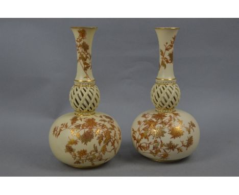 A PAIR OF ROYAL WORCESTER IVORY GROUND ONION SHAPED VASES, shape No.1158, decorated with printed floral sprays with gilt deta