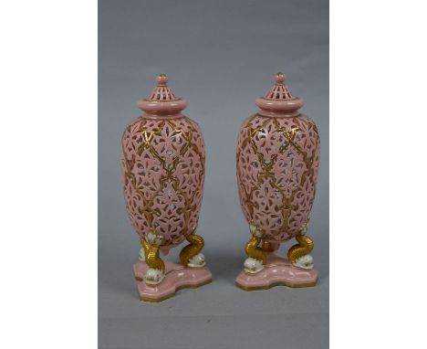A PAIR OF LATE 19TH CENTURY WORCESTER RETICULATED VASES AND COVERS, domed covers with ball finials, ovoid bodies supported on