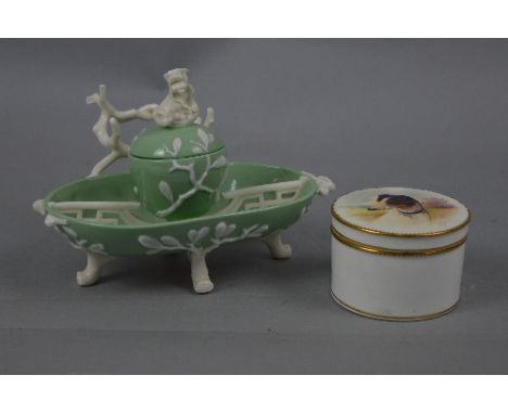 A MINTONS CIRCULAR TRINKET BOX AND COVER, the cover painted with a study of a terrier in a landscape, initialled J.E.D. for J