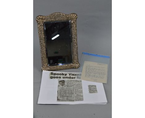 TITANIC INTEREST, a late Victorian silver framed ladies easel back table top mirror, of rectangular form, embossed with folia