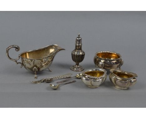 A SECOND HALF OF THE 18TH CENTURY CIRCULAR SILVER SALT, wavy rim, gilt interior, on three cabriole legs with shell feet, mark