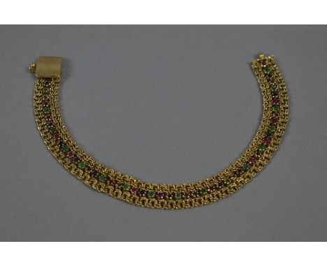 A MODERN EMERALD, RUBY AND SAPPHIRE FLAT LINK BRACELET, measuring approximately 180mm length x 10.3mm width, stamped '585', a