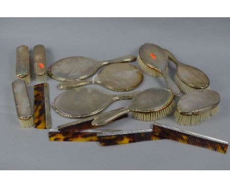 AN ELIZABETH II SILVER BACKED SIX PIECE DRESSING TABLE SET, engine turned decoration, makers Elkington & Co, Birmingham 1964-