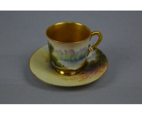 A ROYAL WORCESTER RAYMOND RUSHTON COFFEE CUP AND SAUCER, painted with castles by river landscapes, cup with gilt interior, ha