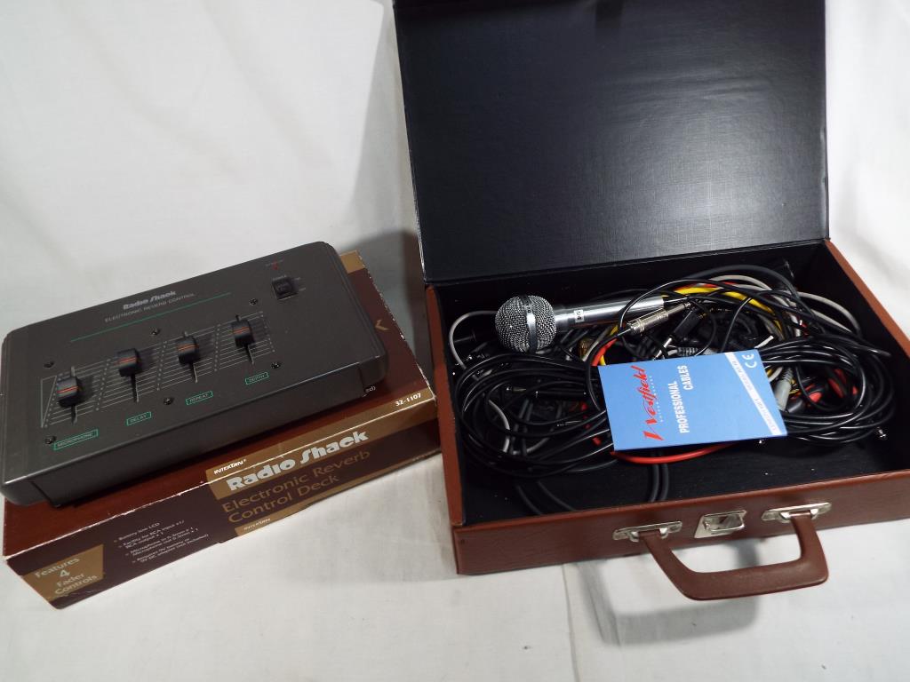 A Radio Shack electronic reverb control deck with four fader controls