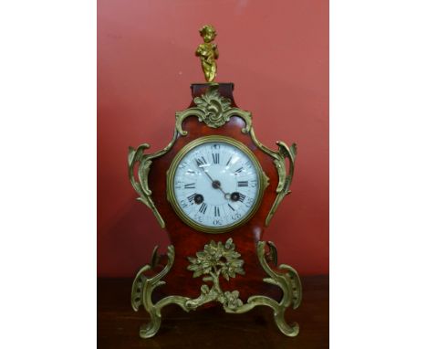 A 19th Century French faux tortoiseshell and ormolu mounted mantle clock, 37cms h 