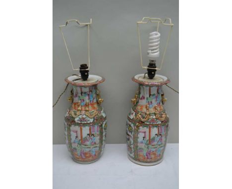 A PAIR OF CHINESE PORCELAIN FAMILLE ROSE VASES with applied gilded salamanders to the necks, floral and figurative panel deco