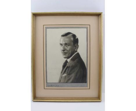 AN AUTOGRAPHED PORTRAIT PHOTOGRAPH OF NOEL COWARD (1899-1973) actor and playwright, inscribed 'For Mrs Dudley from Noel Cowar
