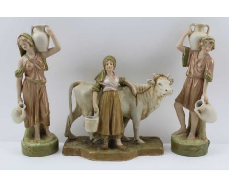A ROYAL DUX OF BOHEMIA CERAMIC FIGURE OF A MILKMAID & COW, muted green, cream, and pink colours, gilded, pink triangle factor