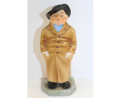 A ROYAL WORCESTER CERAMIC FIGURE 'Caddy', modelled by 'James Hadley', printed and painted factory marks to base, include (187