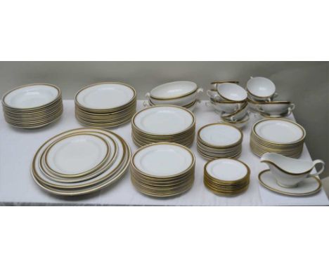 A COMPOSITE WHITE POTTERY DINNER SERVICE with gilt and Greek key rim, some pieces are marked 'Hammersley', retailed through T