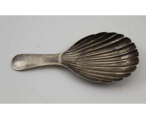 WILLIAM OSBORNE A GEORGE IV SILVER CADDY SPOON of scallop form, with plain handle. Dublin 1821, 13.9g 