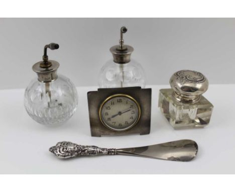 F.H. ADAMS &amp; CO. AN ART DECO TRAVEL CLOCK, engine turned case, the dial with Arabic numerals, easel back, Birmingham, yea