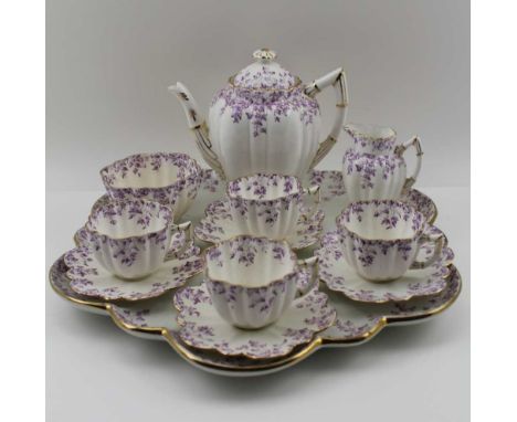 A FOLEY CHINA CABARET SET, c.1900, comprising the petal edge tray, 37.5cm in diameter, teapot with cover, milk jug, sugar bow