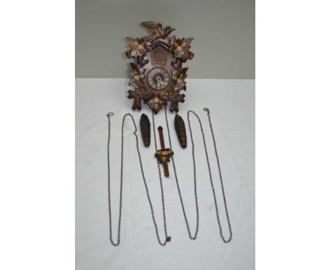 A SMALL BLACK FOREST CUCKOO CLOCK, floral painted decoration, cast pine cone weights, the case 23cm high 