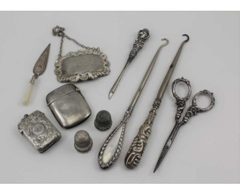 A LATE VICTORIAN SILVER VESTA CASE, Birmingham 1892, with chased decoration, together with a plain silver vesta, a silver 'Ma