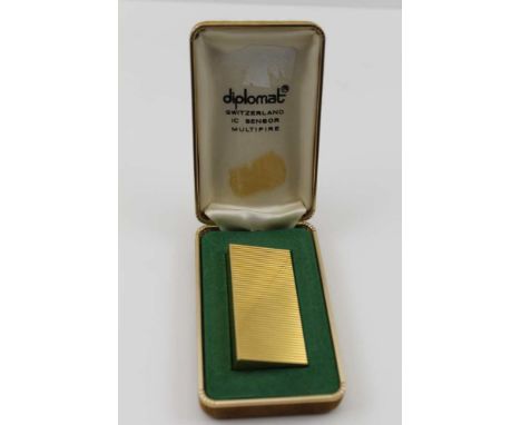 A 'DIPLOMAT' PLATED POCKET LIGHTER, of ridged form, 6.5cm x 3cm, marked 'diplomat ic sensor', in original case 