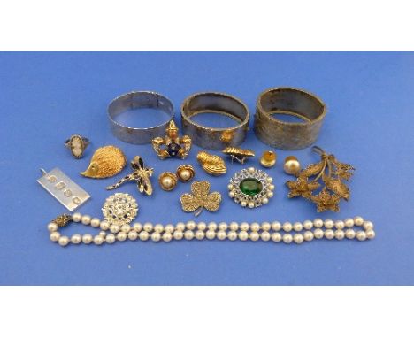 A quantity of silver and Costume Jewellery, including a silver bangle in the form of a belt with engraved foliate central bor