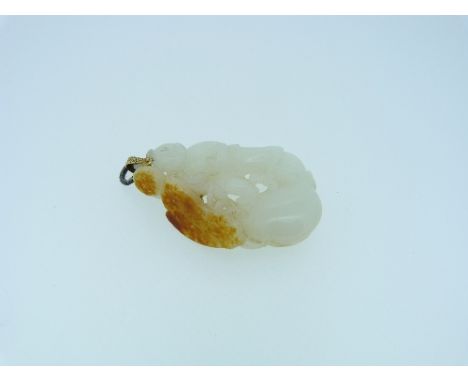 An Oriental pale jade Pendant, carved and pierced depicting a man fighting a giant insect, with gilt metal suspension loop, 2