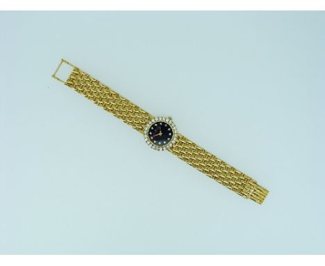 Baume & Mercier, a lady's 18ct gold and diamond wristwatch, the circular black dial with arrow-hands and diamond hour markers