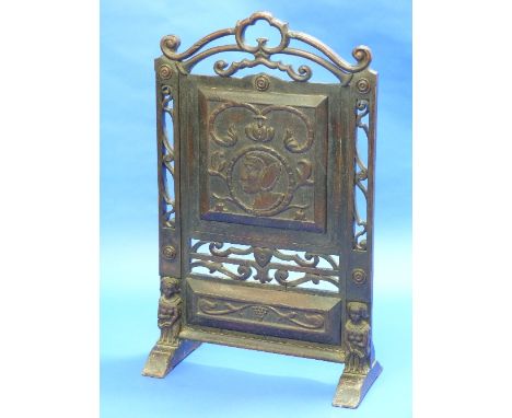 A Victorian carved oak Fire Screen