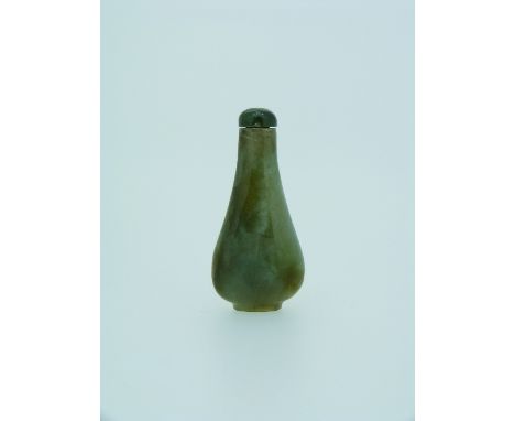 A Chinese jade Snuff Bottle, of pear shaped form, with a darker green jade stopper, 2¼in (6cm) high.