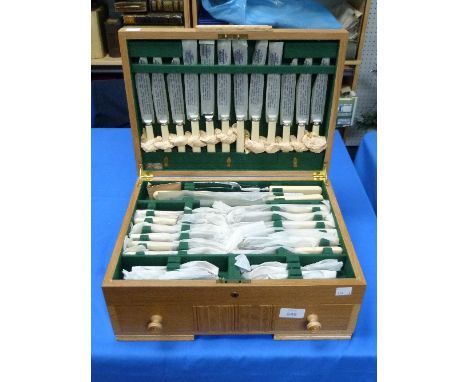 A silver plated sixty-nine piece Canteen of Cutlery, including six place setting, bone handled table knives and forks, desser