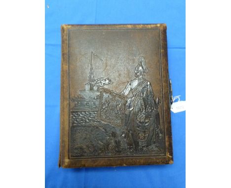 An Army & Navy Carte de Visite album, the leather cover embossed with military and naval images, enclosing thirteen pages wit