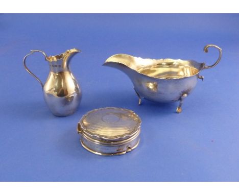 An Edwardian silver Sauce Boat, by Wilson & Gill, hallmarked Birmingham, 1903 of plain traditional form with cut edge, raised