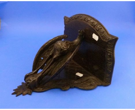 A late Victorian oak Wall Bracket, carved in the form of an eagle-type bird.
