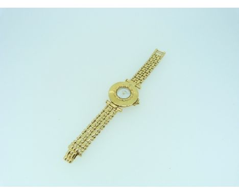 Jaeger Le Coultre, a lady's 18ct gold wristwatch, the mother-of-pearl dial within a beaded bezel and circular case set with a