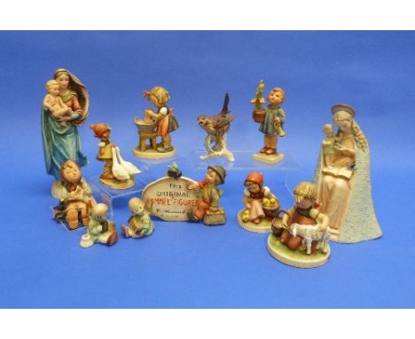 A 'The Original "Hummel" Figures' shop sign, 5½in (14cm) wide, together with eleven other Hummel pieces including two religio