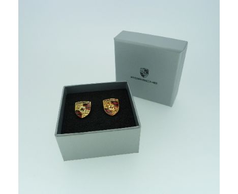 Porsche Interest: A pair of silver gilt cufflinks, the front modelled with black and red enamel as the Porsche emblem, with t