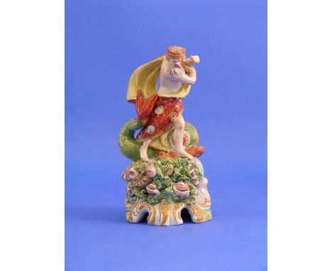 An early 19thC Staffordshire Pottery figure of Neptune, modelled standing on a tall base, with scrolled decoration, the base 