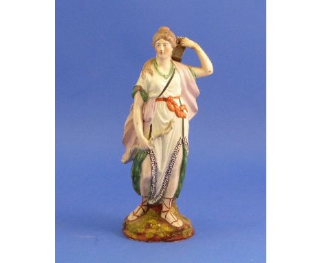 A Staffordshire Pottery figure of Diana the Huntress, standing holding a bow in her left hand and quiver on her back, decorat