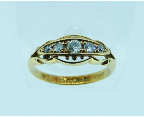 A graduated five stone Diamond Ring, set in a fancy 18ct yellow gold mount and shank, Size N. 