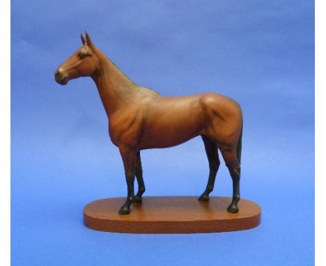 A Beswick pottery "Arkle Champion Steeplechaser" model, MN.2065, matt, on oval wooden base, overall 11¾in (30cm) high. 