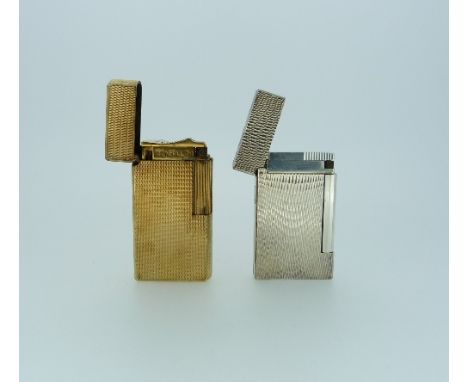 A Dupont silver-plated Cigarette Lighter, 2?in (5.25cm) high, and a Dunhill 70 gilt metal cigarette lighter (2)