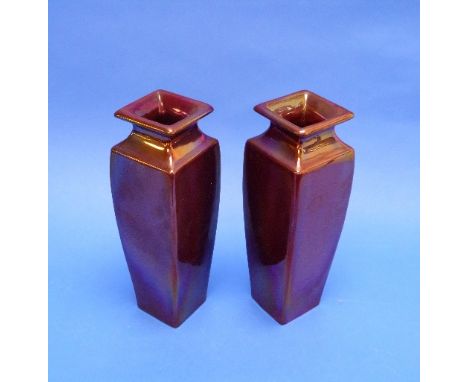 A pair of early Carter & Co. Poole pottery red lustre Vases, each of square baluster form, incised mark to base 'Carter Co Po