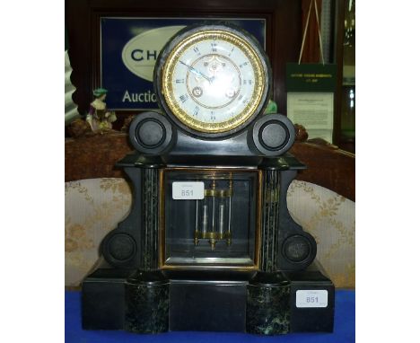 A Victorian black slate and marble Mantel Clock, of architectural form, the circular dial above scrolled shoulders and fluted