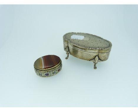 A George V silver hinged Jewellery Box, by Henry Matthews, hallmarked Birmingham 1910, of shaped oblong form, with engine tur