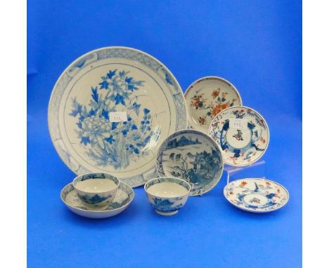 A pair of oriental blue and white porcelain Tea Bowls and Saucers, painted with the Willow pattern, and an oriental porcelain