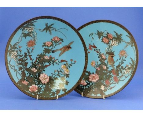 A pair of Chinese cloissoné enamel Chargers, blue ground, decorated with birds amongst flowering shrubs, 12?in (30.75cm) diam