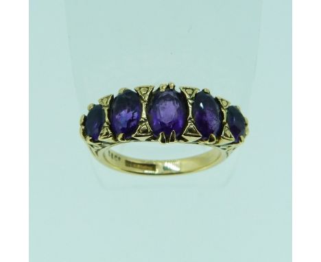 A graduated five stone amethyst Ring, mounted in 9ct yellow gold, Size K.