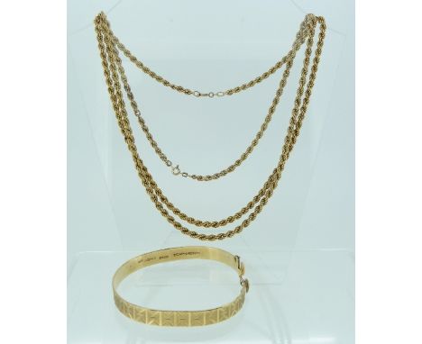 A 9ct yellow gold bangle, with bright cut decoration, 15g, together with a 9k yellow gold double twisted chain, 22in (56cm) l