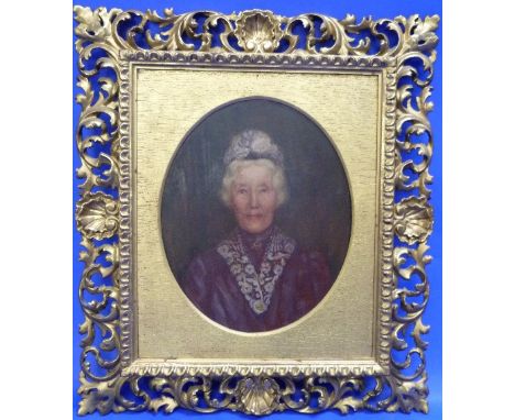 Early 20thC School Portrait of a lady oil on panel, oval, 11½in x 9½in (29cm x 24cm) in ornate carved and pierced shell and s