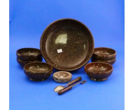 A seven piece Serpentine Dessert Set, comprising a serving bowl and six side bowls, together with a Serpentine handled spoon 