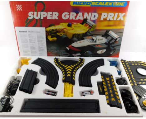 A Micro Scalextric Super Grand Prix cased set, boxed. 